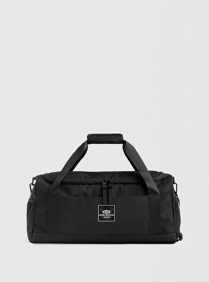 On bag view of a square embroidered patch with a black background and white RORF logo with an owl, along with "Rebel of RORF" text, ideal for personalizing gym bags or workout accessories buy at radowl ultimate gy wear brand