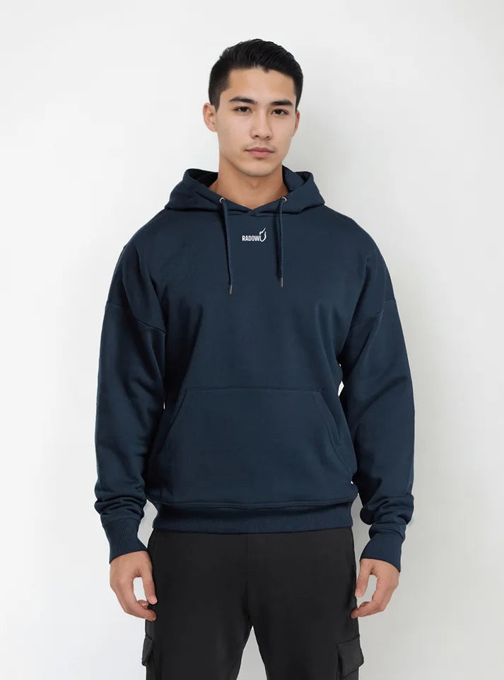 A gym athlete wearing navy hoodies from Radowl gym wear brand, this hoodie have Radowl signature and logo printed on it and the name of this product is "Slay Oversized Heavy Hoodie Navy"