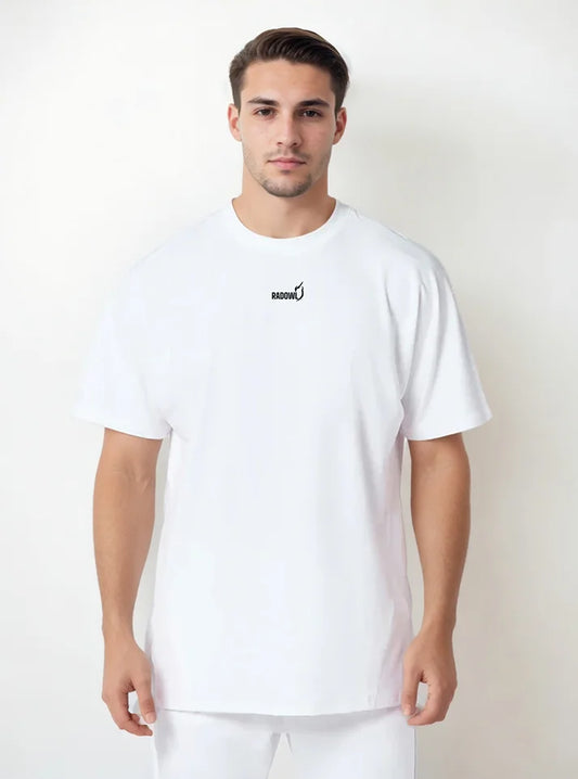 A male model wearing white Strength Heavyweight Oversized Tee White from Radowl gym wear brand this tshirt made of heavy terry which keep body warms in winters and half sleeve give you best arms mobility.