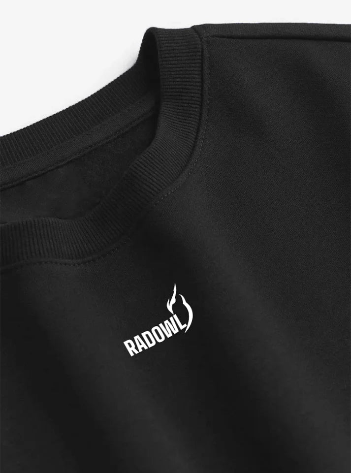 This image is a closeup image of "Grind Oversized Sweatshirt Black"  a gym sweatshirt for men from Radowl, a perfect apparel for winters to wear in gym.