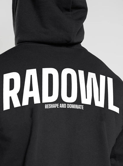 This image is the back side of a hoodie from Radowl and this hoodie name is "Legacy Oversized Heavy Hoodie Black" this hoodie is blac in colour and "Radowl" is printed at back side with bold font in whit color and at the front Radowl signature and logo is printed, this hoodie is best choice for mens who workout in winters.