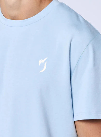 Close up image of strength heavyweight oversized gym tshirt ice blue color this photo shows the detail and radowl logo from up close.
