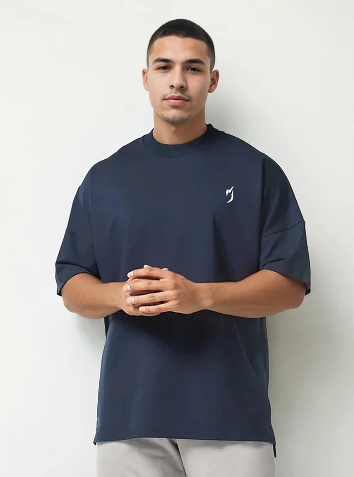 Front view of a male model wearing oversized gym tshirts for winter with navy colour, this tshirt have Radowl gym wear brand logo, it's a perfect tshirt for workout because half sleeve give you un restricted movement and hevy terry fabric keeps you warm.
