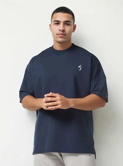 Front view of a male model wearing oversized gym tshirts for winter with navy colour, this tshirt have Radowl gym wear brand logo, it's a perfect tshirt for workout because half sleeve give you un restricted movement and hevy terry fabric keeps you warm.