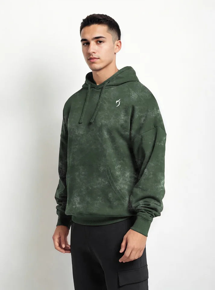 In this image a gym athlete is wearing Huner green acid washed sporty fit gym hoodie by Radowl gym wear Brand this product name is "Wild Force Acid Wash Gym Hoodie - Hunter green" this hoodie have sporty fit,